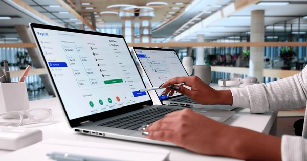 Financial admin using payroll software app - pay as you go workers comp