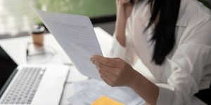 Professional analyzing tax paperwork documents - Florida payroll tax guide